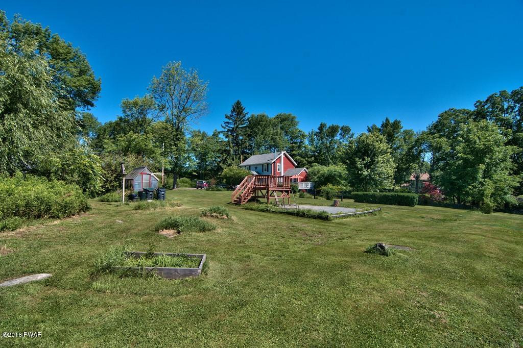 72 Hemlock Road Lake Ariel, PA 18436 - Photo 5 of 48 a garden with trees in the background