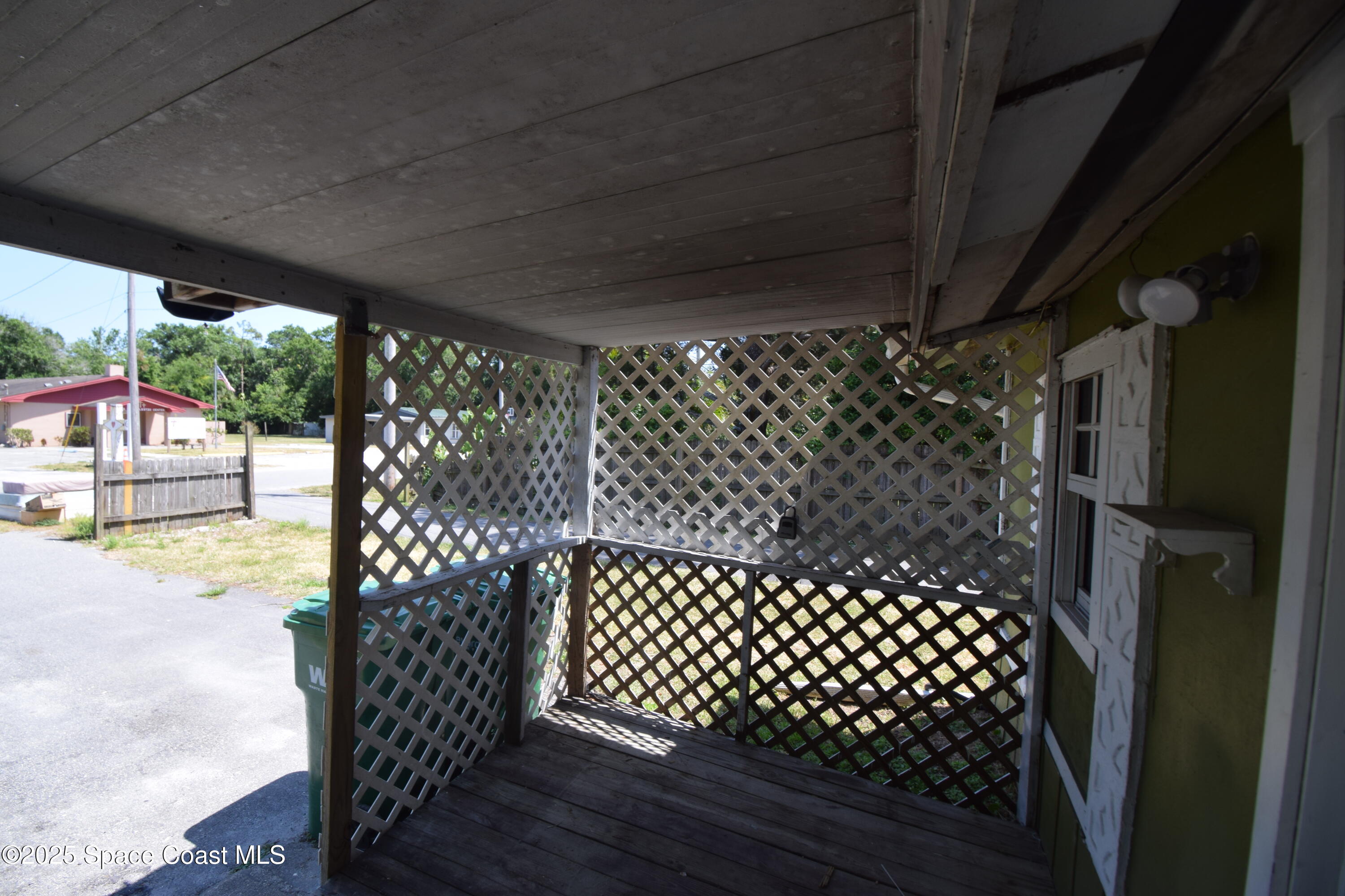 329 Pine Avenue, Unit E Cocoa, FL 32922 - Photo 2 of 11 a view of a black gate