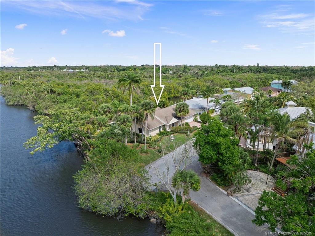 815 Southwest Salerno Road Stuart, FL 34997 - Photo 13 of 71 a view of a city with lush green forest