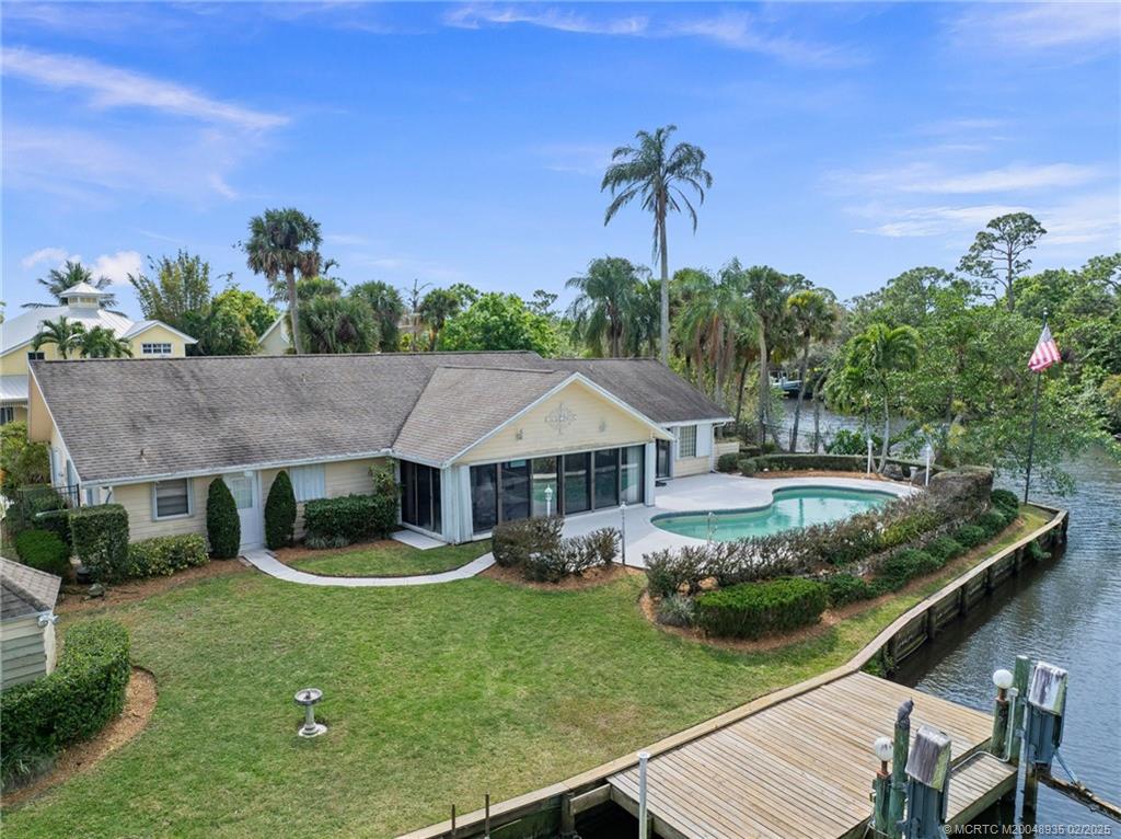 815 Southwest Salerno Road Stuart, FL 34997 - Photo 16 of 71 a front view of a house with garden