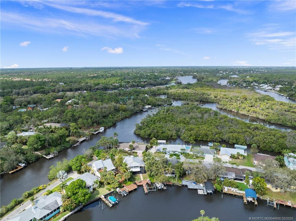 815 Southwest Salerno Road Stuart, FL 34997 - Photo 19 of 71 an aerial view of a houses with outdoor space