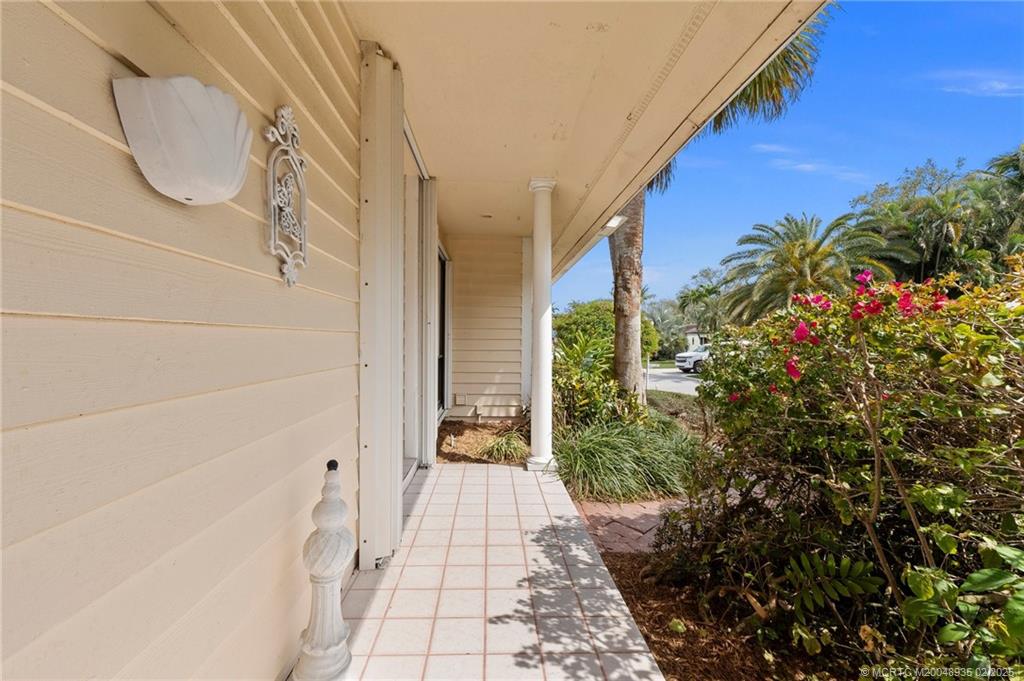 815 Southwest Salerno Road Stuart, FL 34997 - Photo 26 of 71 a view of a pathway both side of house