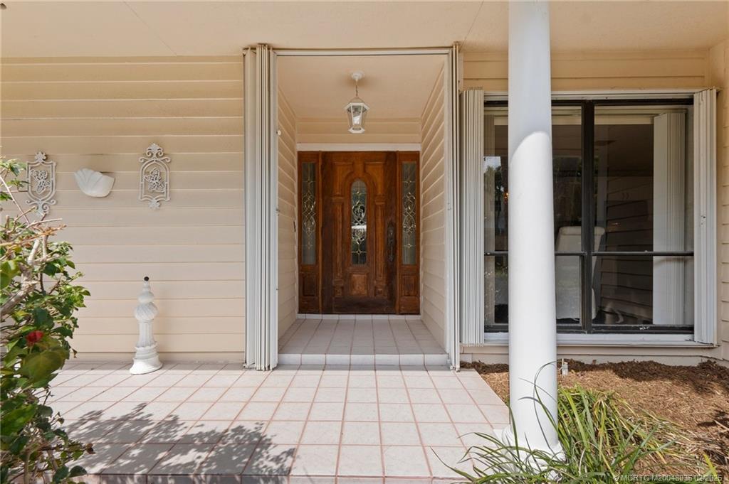 815 Southwest Salerno Road Stuart, FL 34997 - Photo 27 of 71 a view of a entryway door of the house