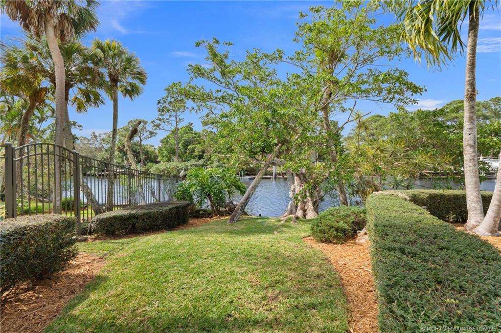 815 Southwest Salerno Road Stuart, FL 34997 - Photo 29 of 71 a view of a backyard with plants and a garden