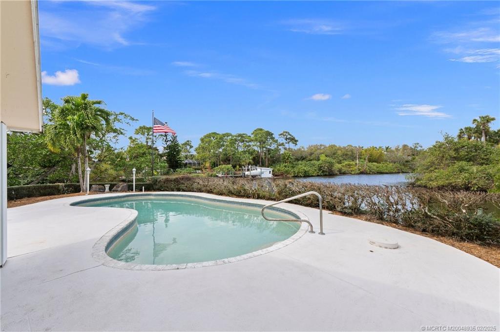 815 Southwest Salerno Road Stuart, FL 34997 - Photo 34 of 71 a view of a swimming pool from a balcony