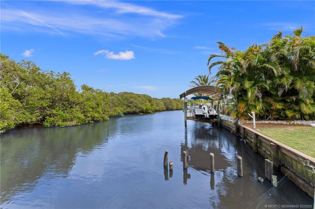 815 Southwest Salerno Road Stuart, FL 34997 - Photo 35 of 71 a view of a lake with a outdoor space