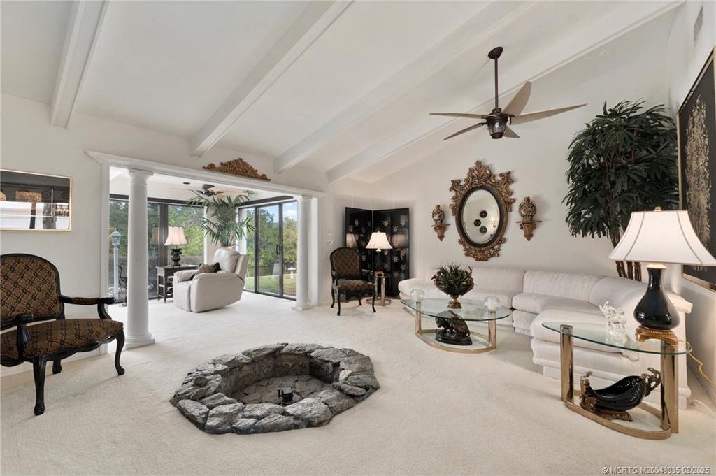 815 Southwest Salerno Road Stuart, FL 34997 - Photo 45 of 71 a living room with furniture and a large window