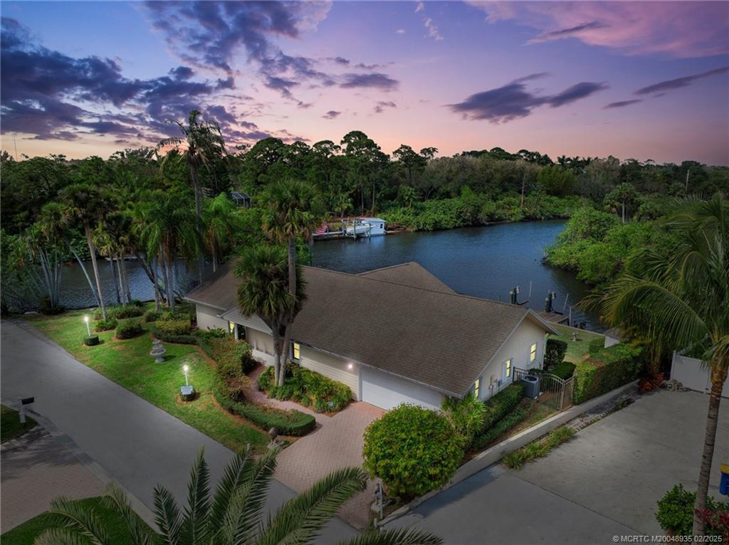 815 Southwest Salerno Road Stuart, FL 34997 - Photo 5 of 71 a view of a lake in middle of the house
