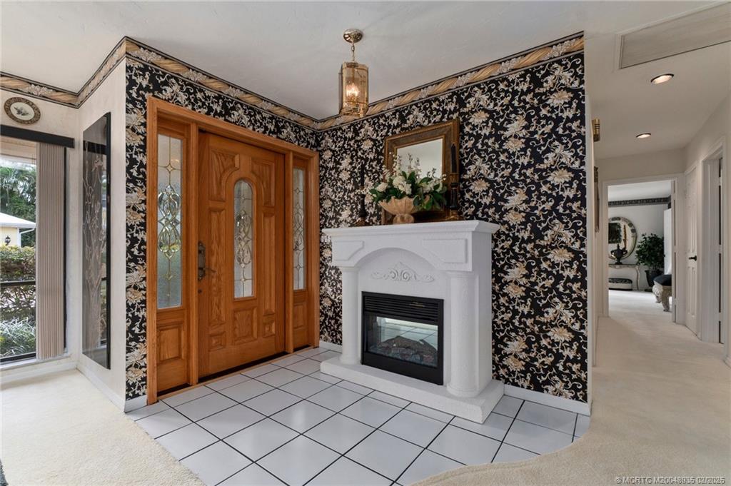 815 Southwest Salerno Road Stuart, FL 34997 - Photo 55 of 71 a view of a livingroom with entryway and window
