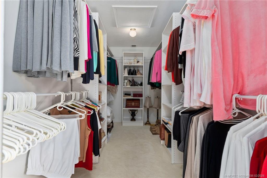 815 Southwest Salerno Road Stuart, FL 34997 - Photo 60 of 71 a view of walk in closet with clothes