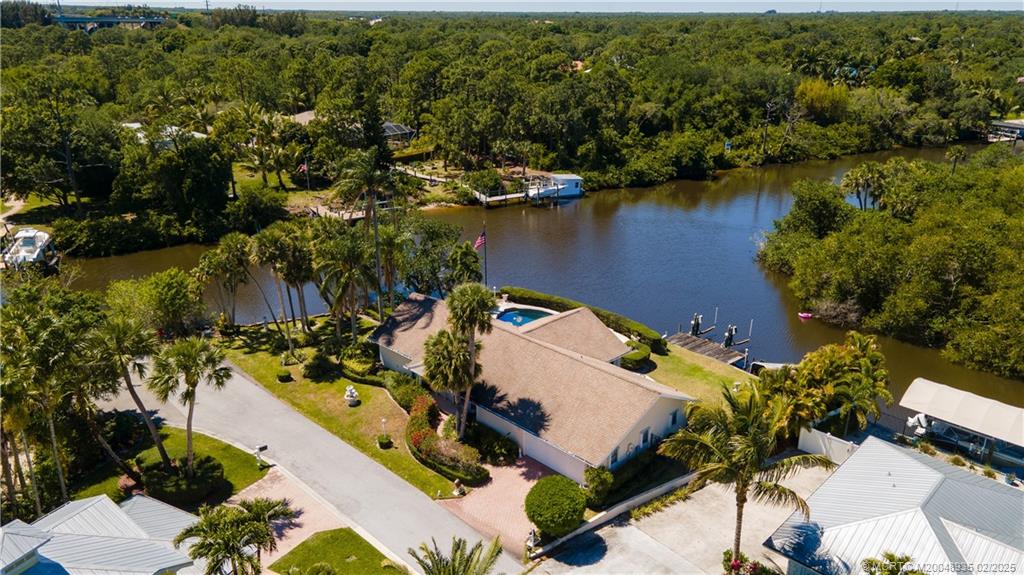 815 Southwest Salerno Road Stuart, FL 34997 - Photo 70 of 71 an aerial view of residential houses with outdoor space