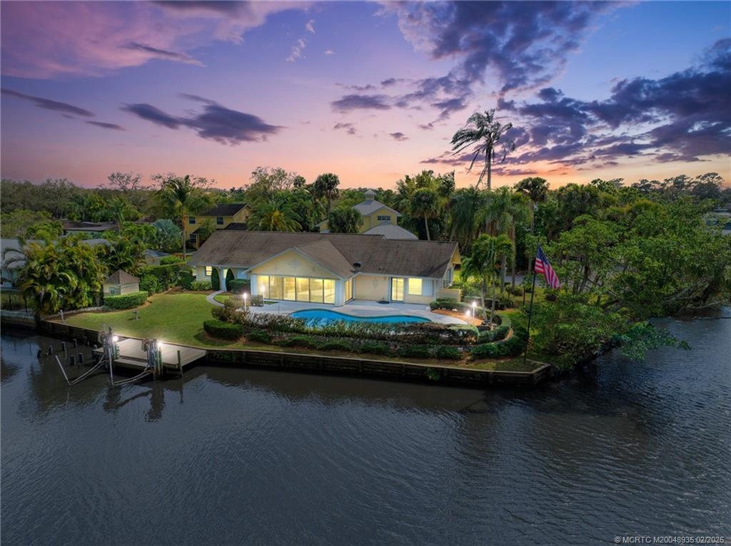 815 Southwest Salerno Road Stuart, FL 34997 - Photo 8 of 71 an aerial view of a house with pool lake view and mountain view