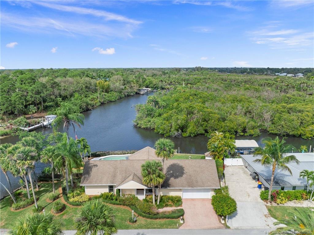 815 Southwest Salerno Road Stuart, FL 34997 - Photo 10 of 71 a view of a lake with a yard