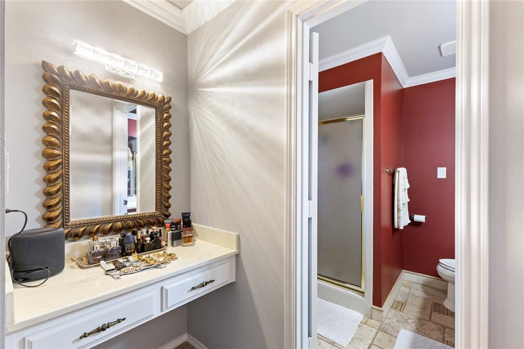 2402 Scott Mill Road Carrollton, TX 75006 - Photo 12 of 20 a bathroom with a sink and a mirror