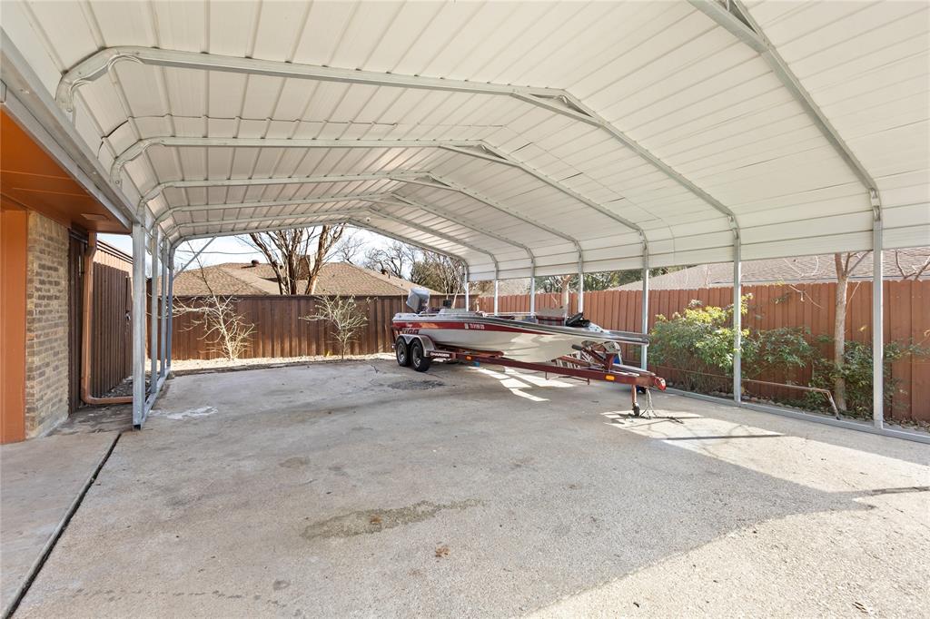 2402 Scott Mill Road Carrollton, TX 75006 - Photo 17 of 20 a view of empty room with wooden floor and iron fence