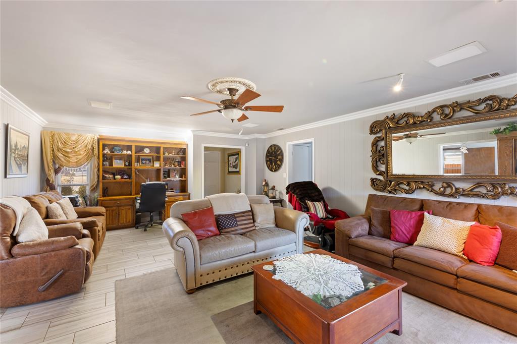 2402 Scott Mill Road Carrollton, TX 75006 - Photo 7 of 20 a living room with furniture and wooden floor