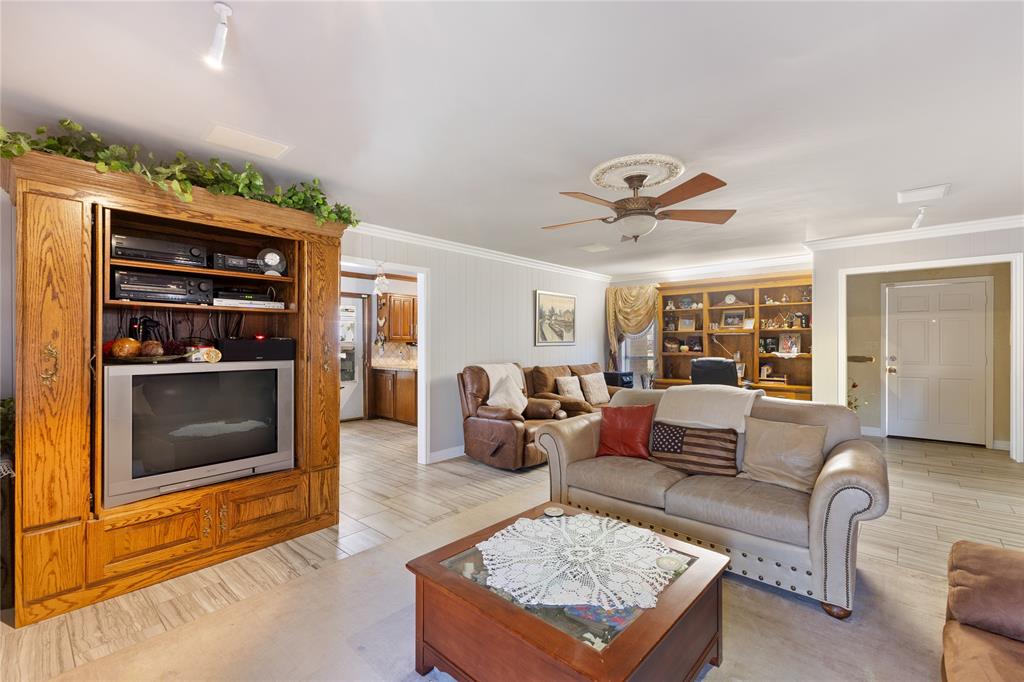 2402 Scott Mill Road Carrollton, TX 75006 - Photo 8 of 20 a living room with furniture and a fireplace