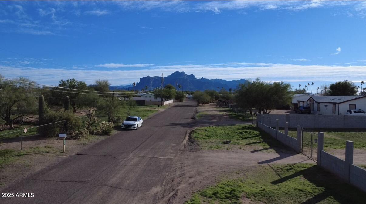 1975 West Smoketree Street Apache Junction, AZ 85120 - Photo 5 of 9 a view of a street with a yard