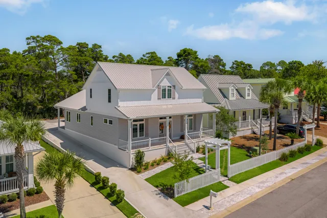 an aerial view of residential houses with city view and lake view