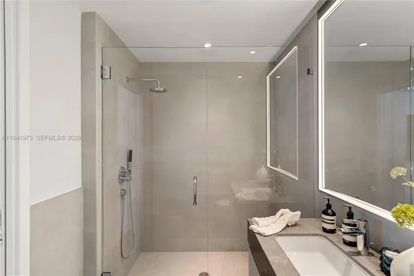 an empty room with closet and wooden floor