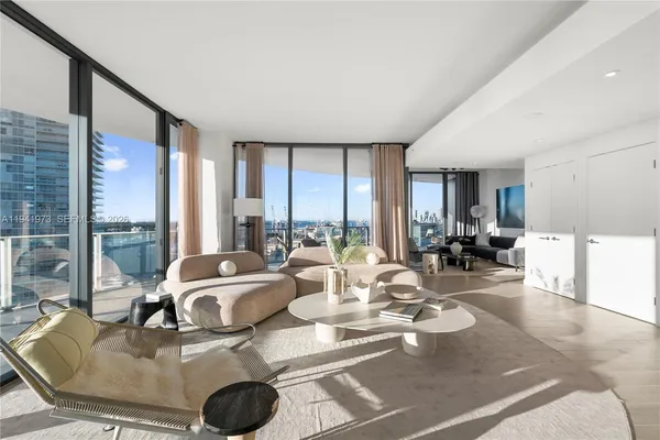 a living room with furniture and a window