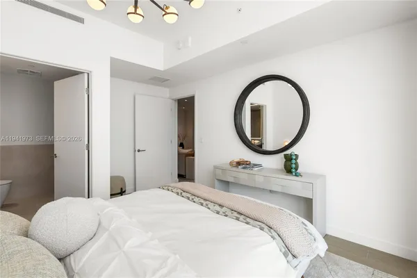 a bathroom with a granite countertop sink a shower and a mirror