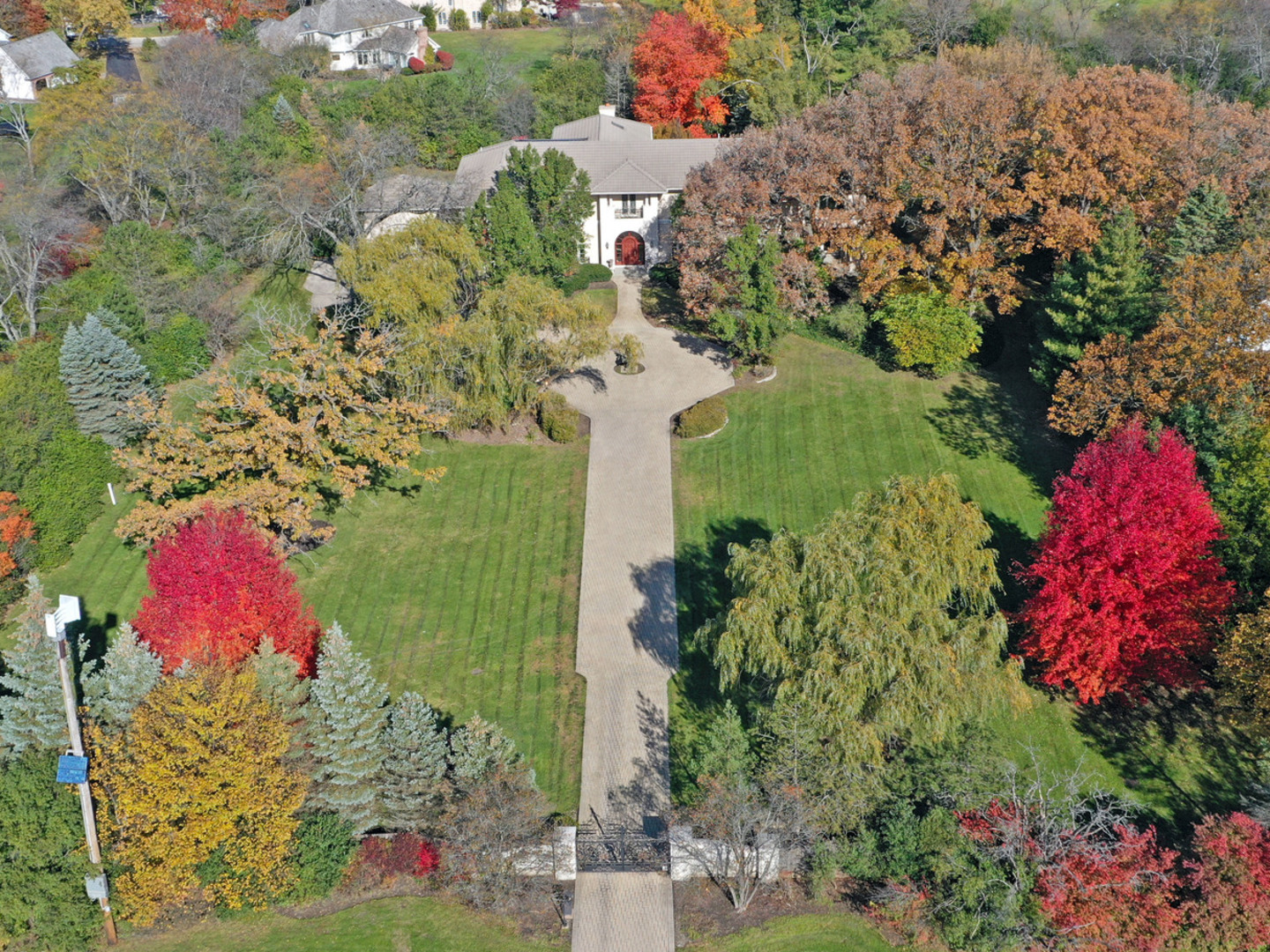 a aerial view of a house with a yard and garden