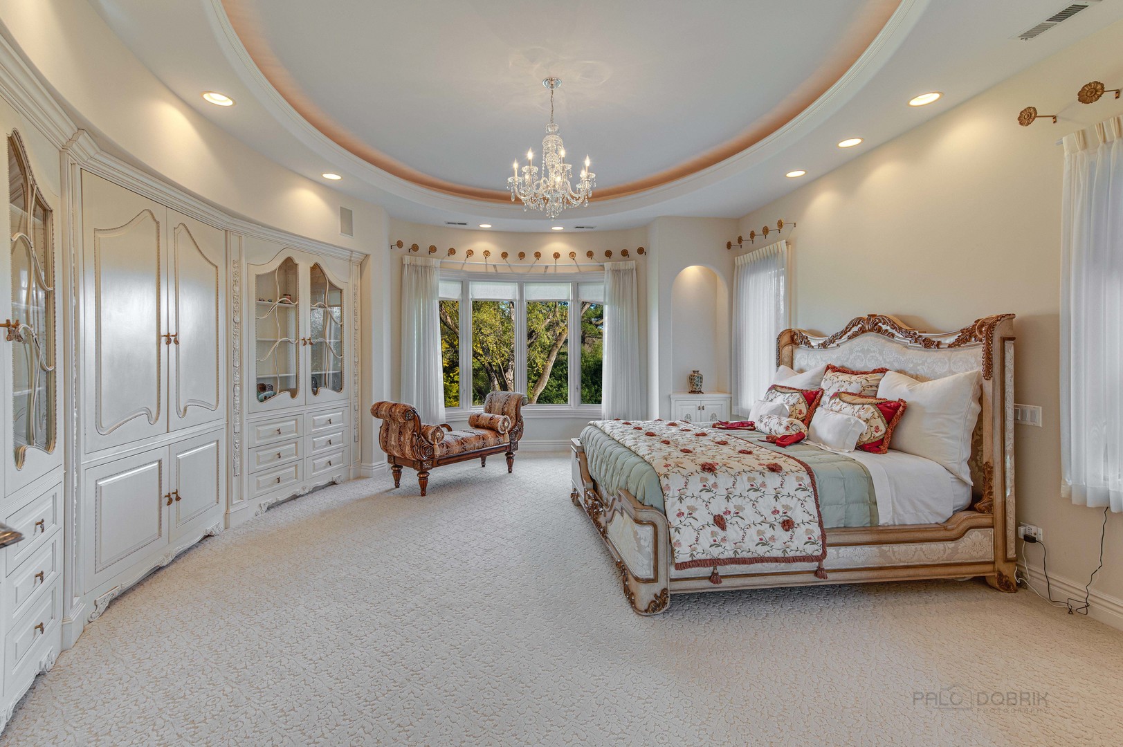 10 West Westleigh Road Lake Forest, IL 60045 - Photo 34 of 59 a spacious bedroom with a bed and a chandelier