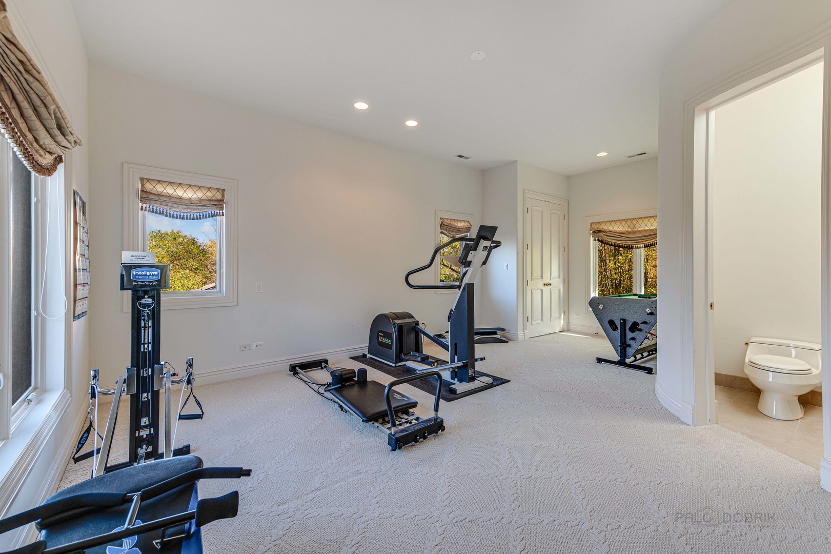 10 West Westleigh Road Lake Forest, IL 60045 - Photo 44 of 59 a room with gym equipment and a large window