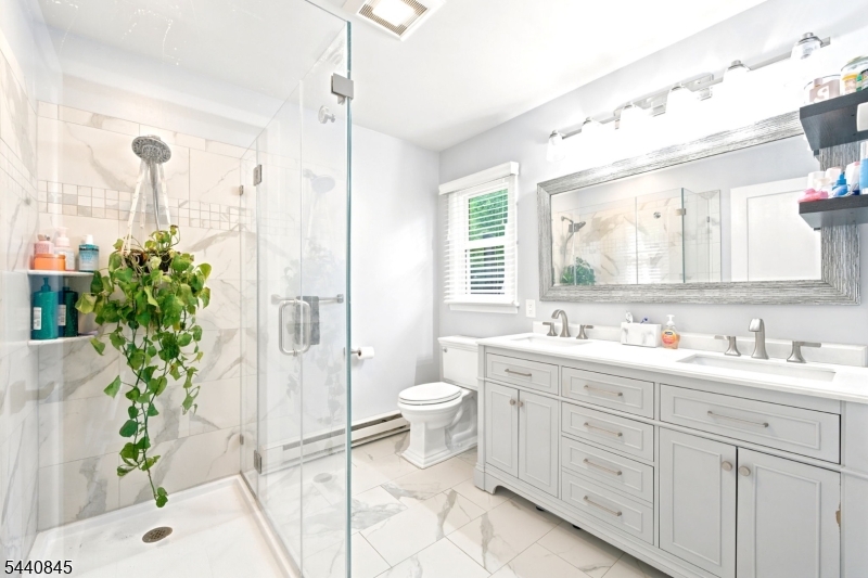 36 Forest Road Andover, NJ 07821 - Photo 45 of 50 a bathroom with a double vanity sink toilet and shower