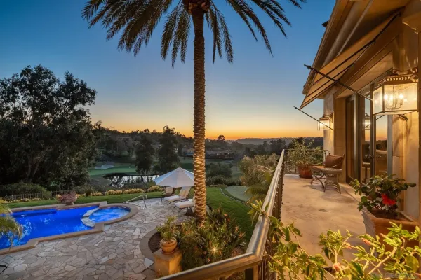 a view of a swimming pool with a patio