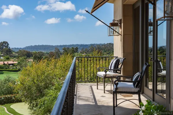a view of a chairs and table in patio