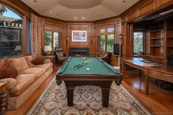 a room with furniture and large windows