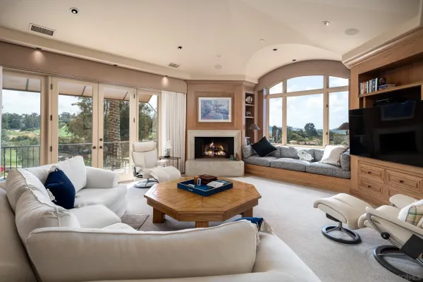 a living room with furniture fireplace and flat screen tv