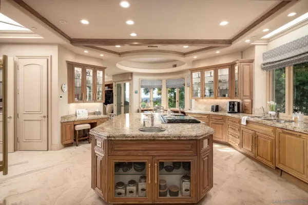 a open kitchen with stainless steel appliances granite countertop a stove and cabinets
