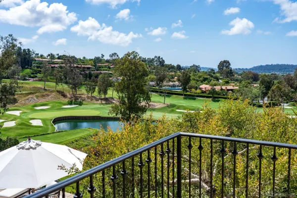 a view of a lake from a balcony