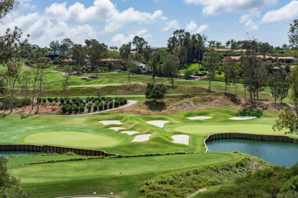 a view of a golf course with a lake