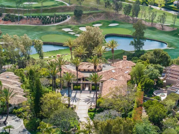 an aerial view of a house with outdoor space