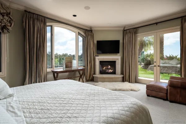 a bedroom with a bed and walk in closet