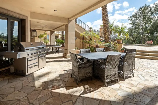 a view of swimming pool with outdoor seating and plants