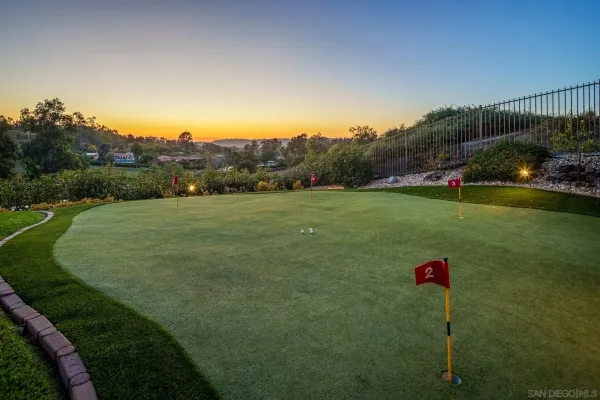 a view of a golf course with a lake