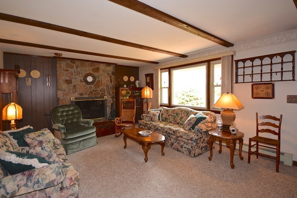 119 Sarah Sherman Road Rochester, MA 02770 - Photo 5 of 22 a living room with furniture and a fireplace