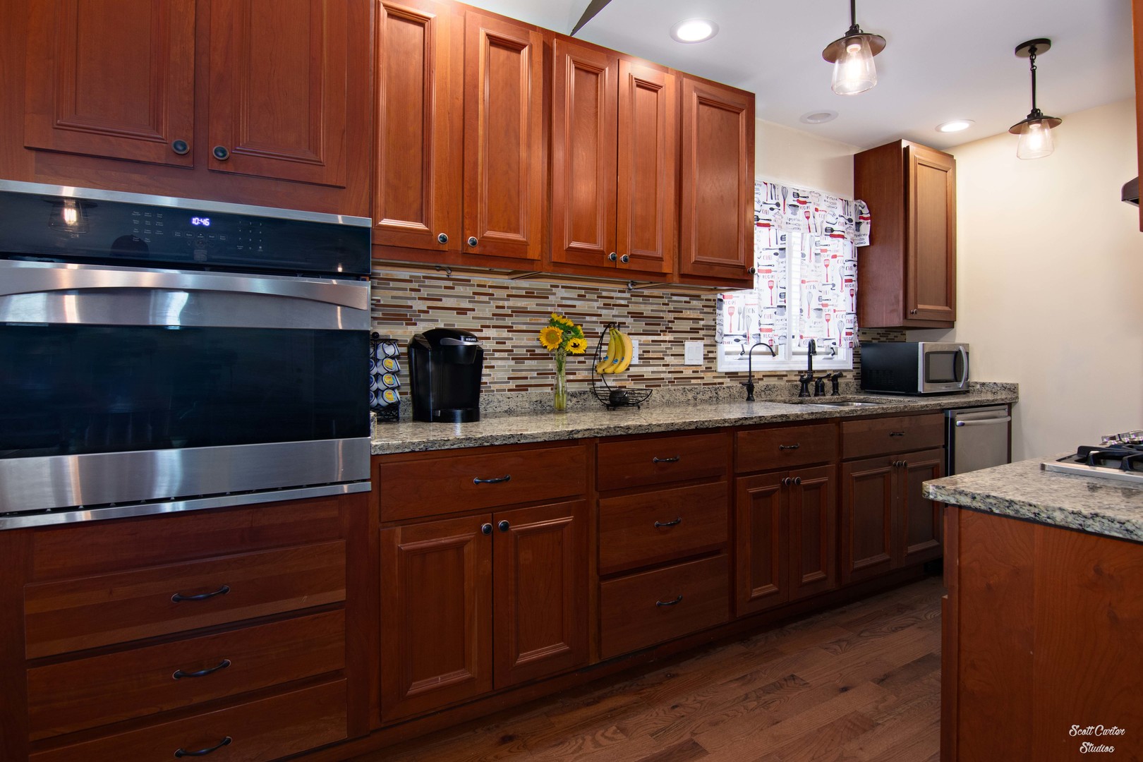 2516 Crystal Lake Road Cary, IL 60013 - Photo 13 of 22 a kitchen with stainless steel appliances granite countertop wooden cabinets and a stove top oven