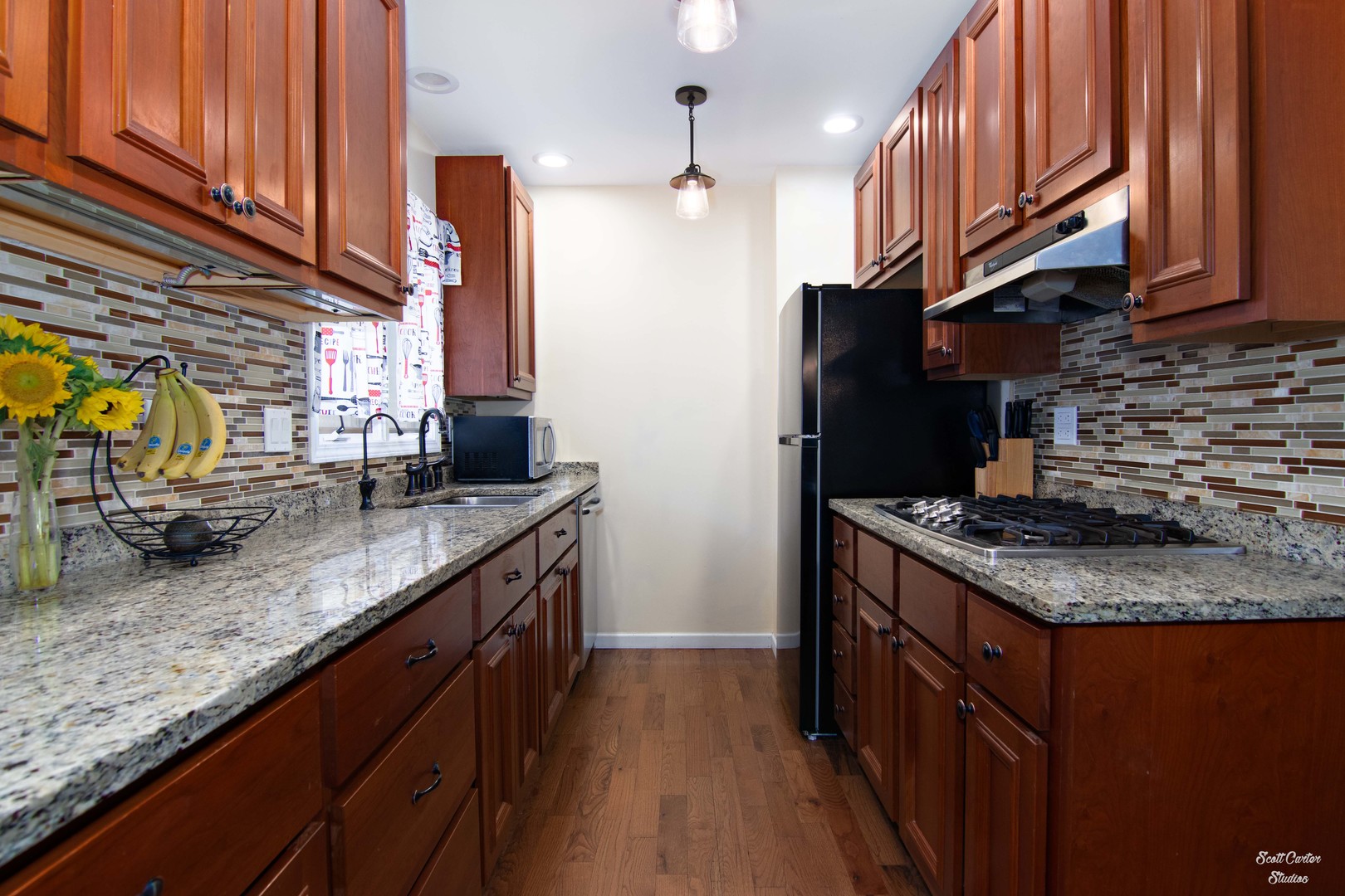 2516 Crystal Lake Road Cary, IL 60013 - Photo 14 of 22 a kitchen with stainless steel appliances granite countertop a stove a sink and a refrigerator