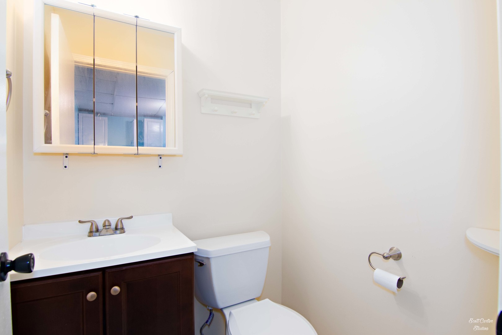 2516 Crystal Lake Road Cary, IL 60013 - Photo 18 of 22 a bathroom with a sink a toilet and a window