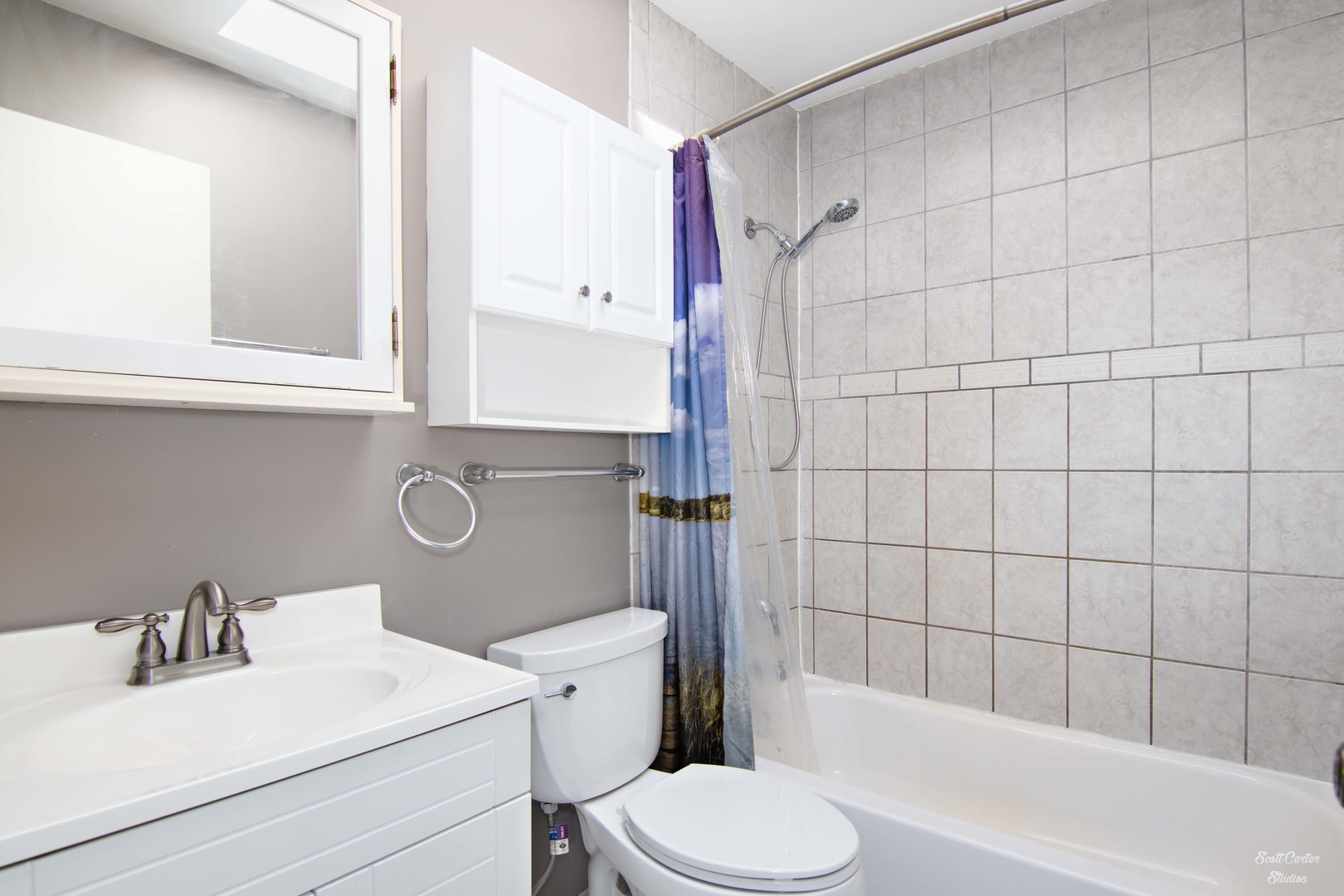 2516 Crystal Lake Road Cary, IL 60013 - Photo 21 of 22 a bathroom with a sink toilet vanity and shower