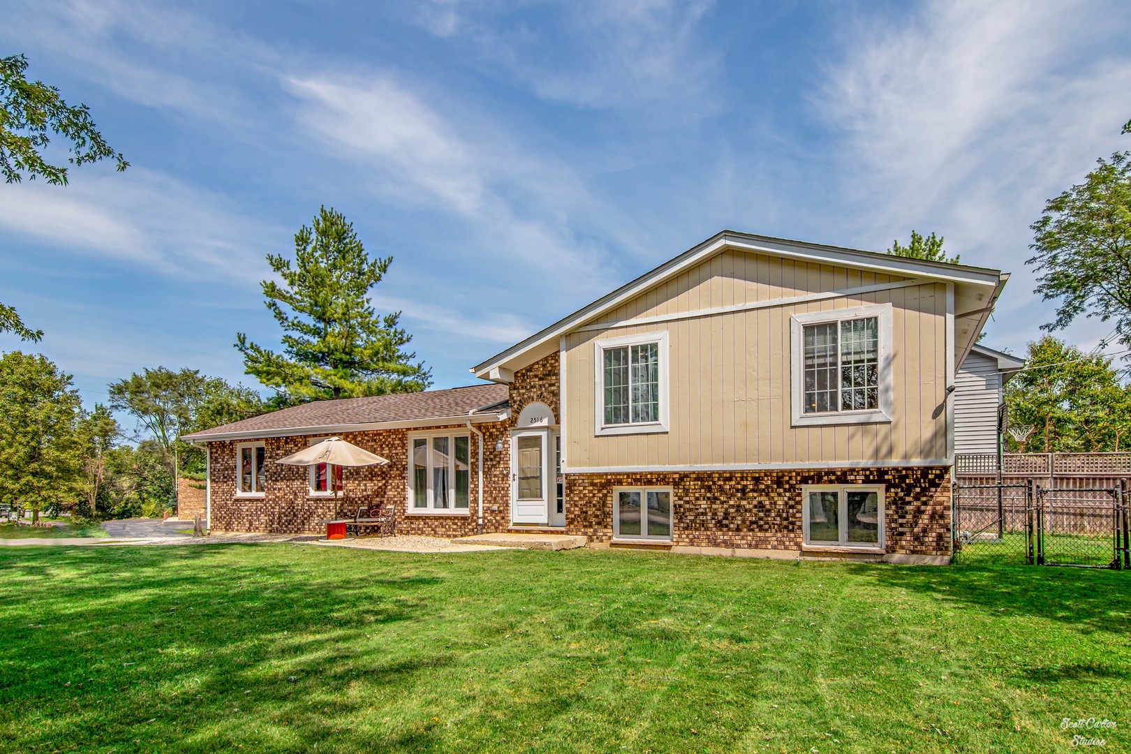 2516 Crystal Lake Road Cary, IL 60013 - Photo 7 of 22 a front view of a house with a garden
