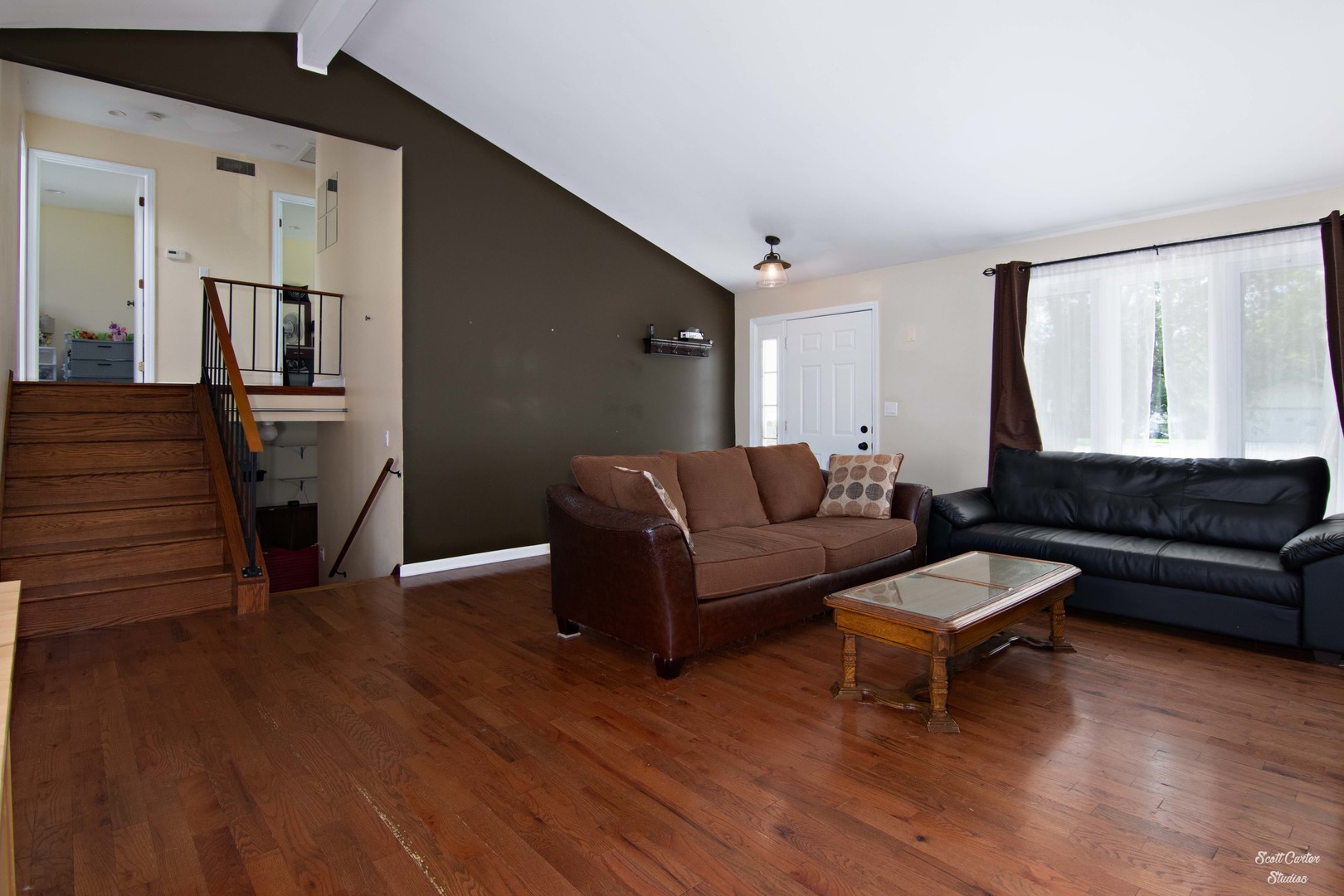 2516 Crystal Lake Road Cary, IL 60013 - Photo 10 of 22 a living room with furniture and a wooden floor
