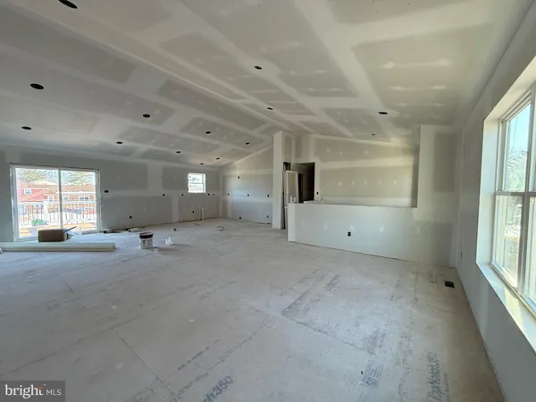 a big room with windows and closet