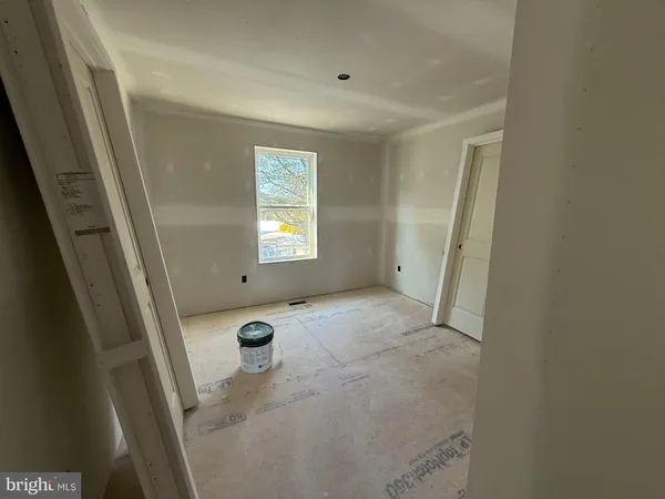 a view of entryway with window and stairs